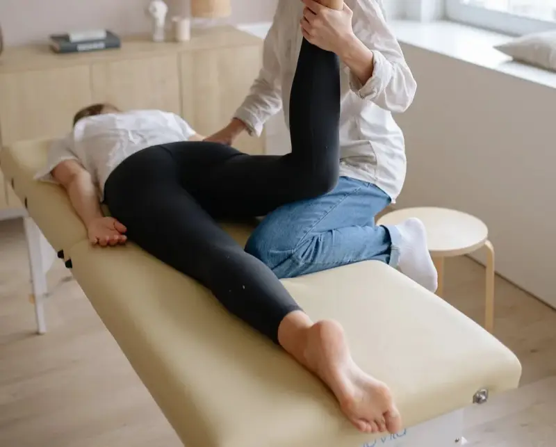 Rider working with horse during a physiotherapy-guided session